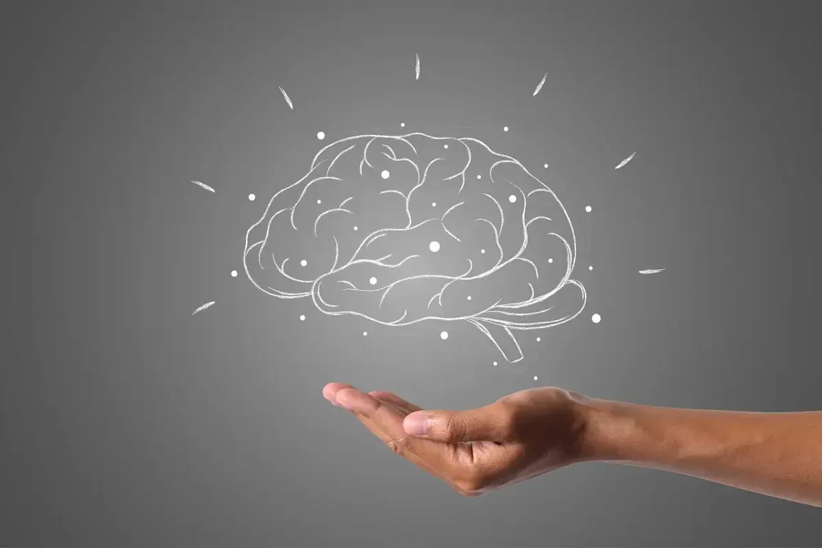 Hand cradling an illustrated brain