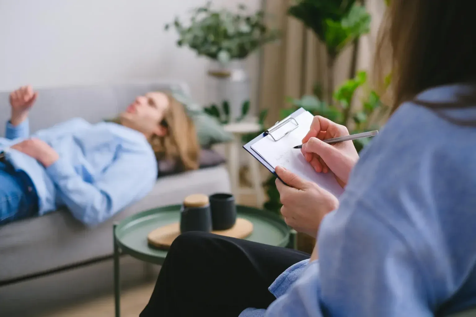 Person resting calmly during a hypnotherapy session