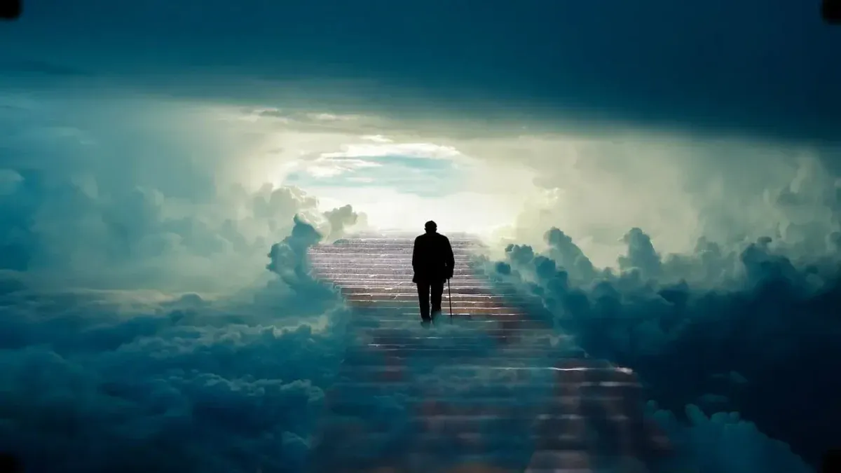 Figure walking along a path of light through the clouds