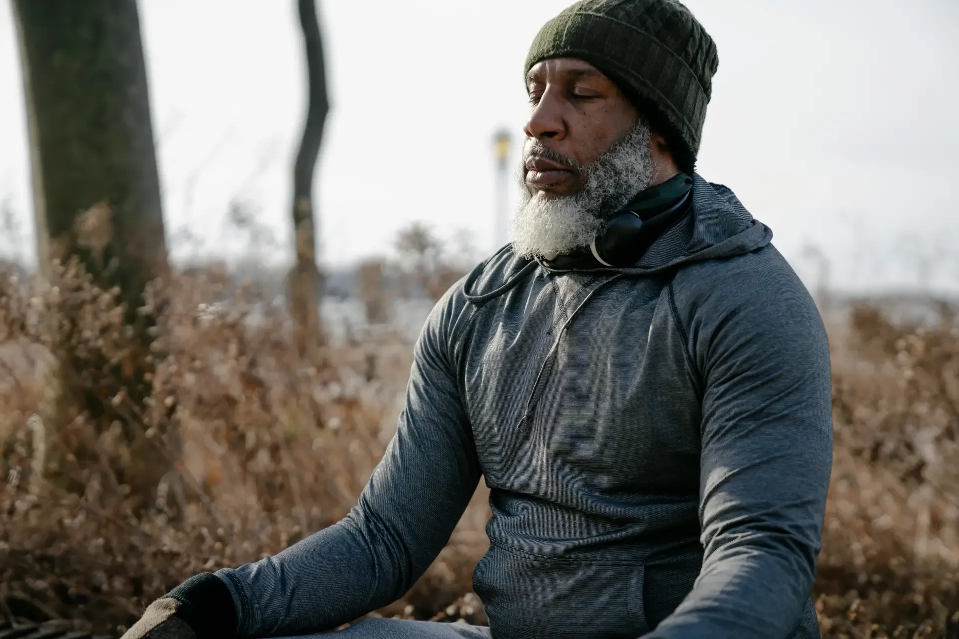 Man meditating peacefully in a forest