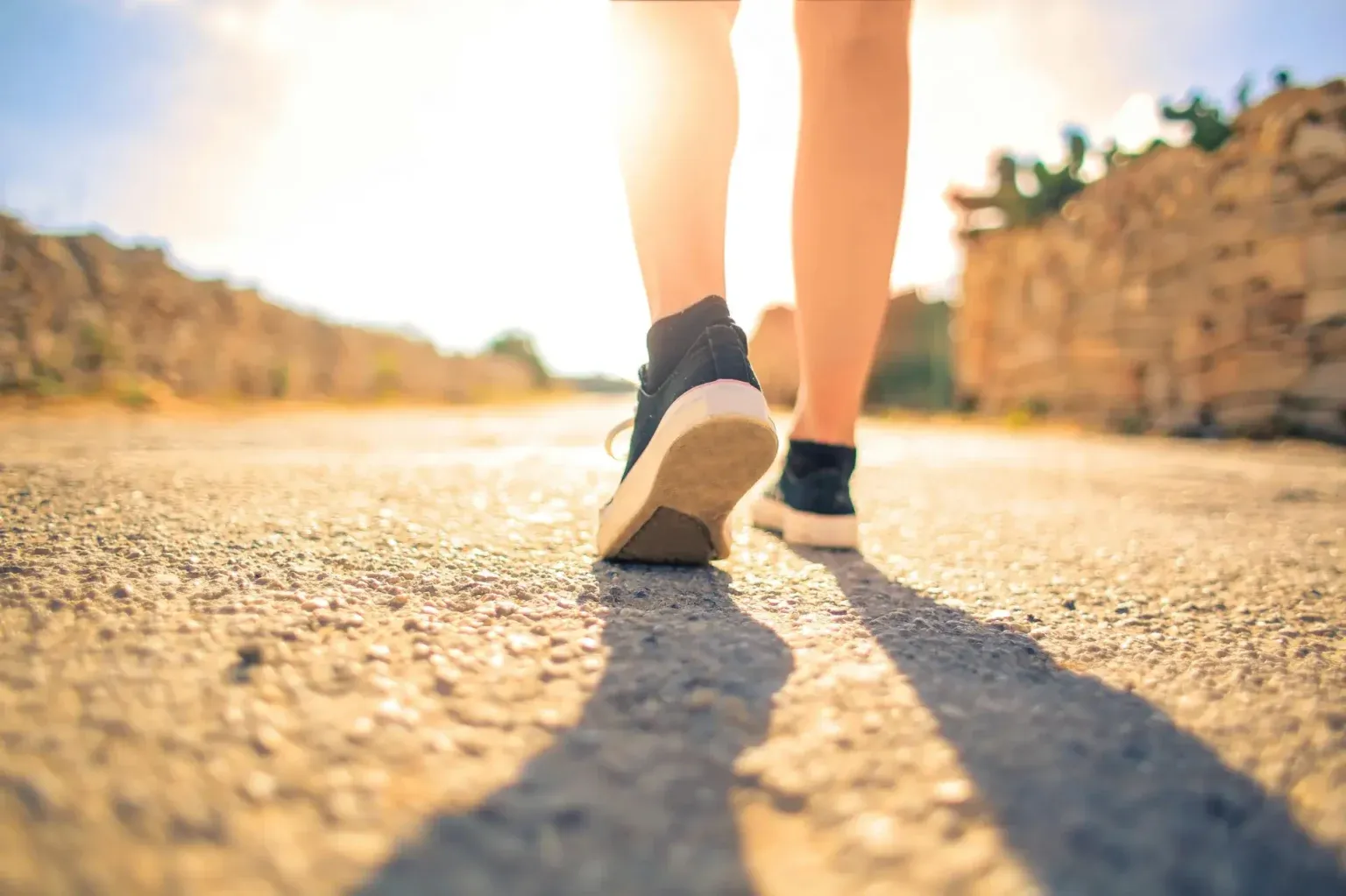 Person walking along an open road