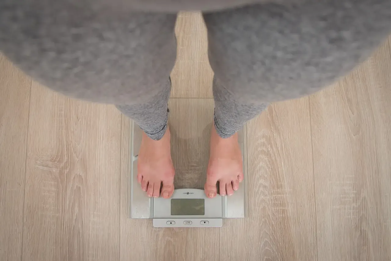 Person standing on bathroom scales
